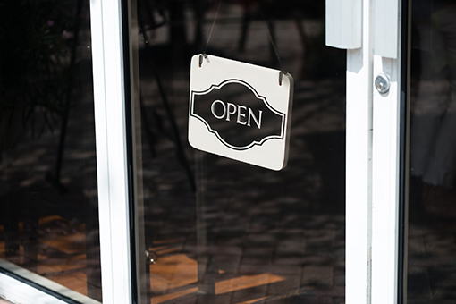 Open Signage on the Impact Door of a Commercial Unit in Tampa Florida