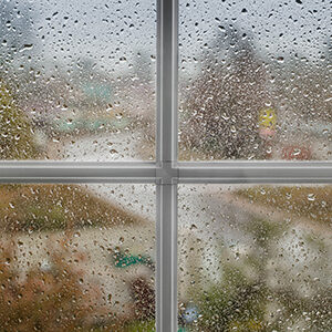 Rain Seen Through Impact Window of Tampa Residence